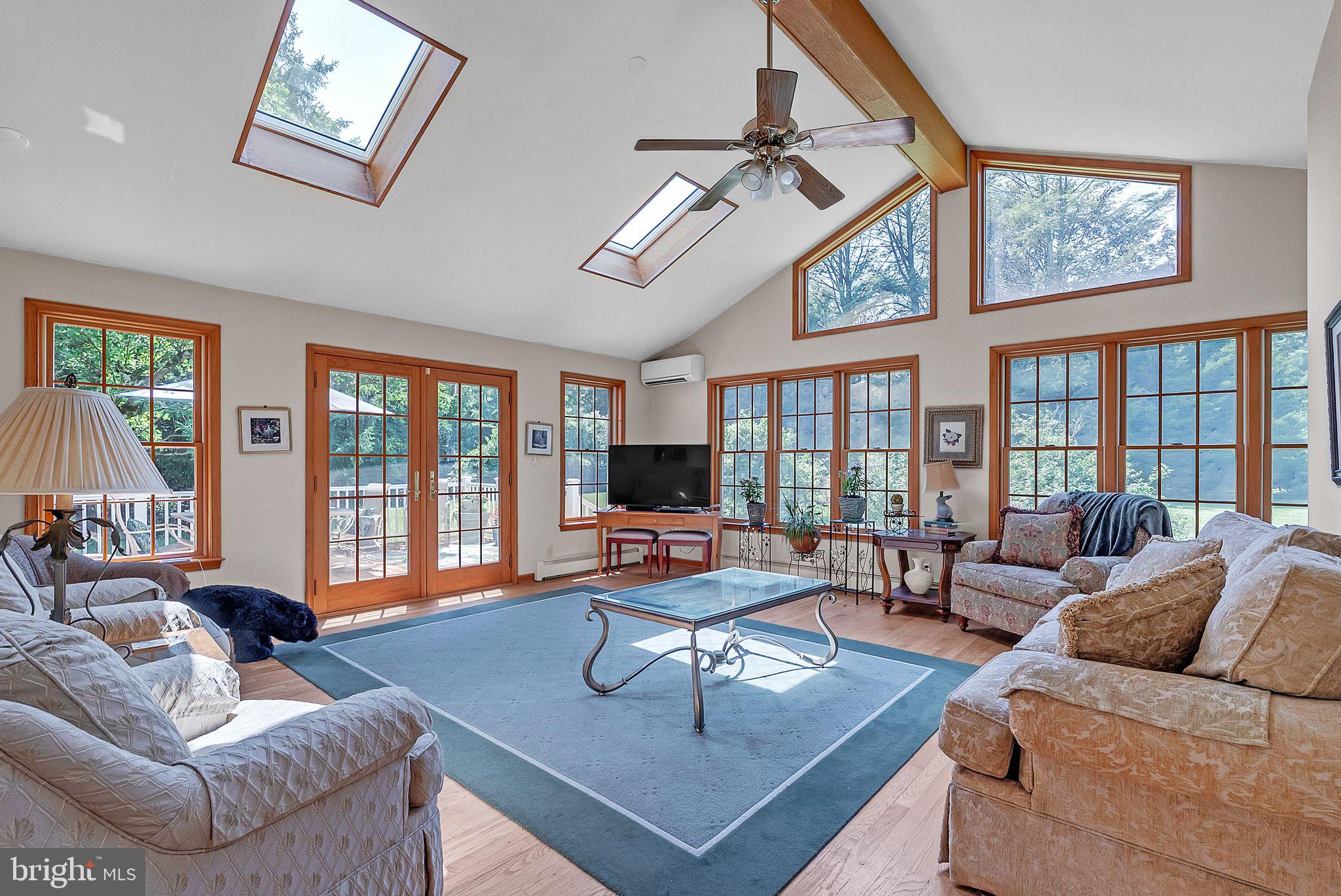 31 Rabbit Run Road Rose Valley, PA 19086 - Photo 13 of 35 a living room with furniture large window and flat screen tv