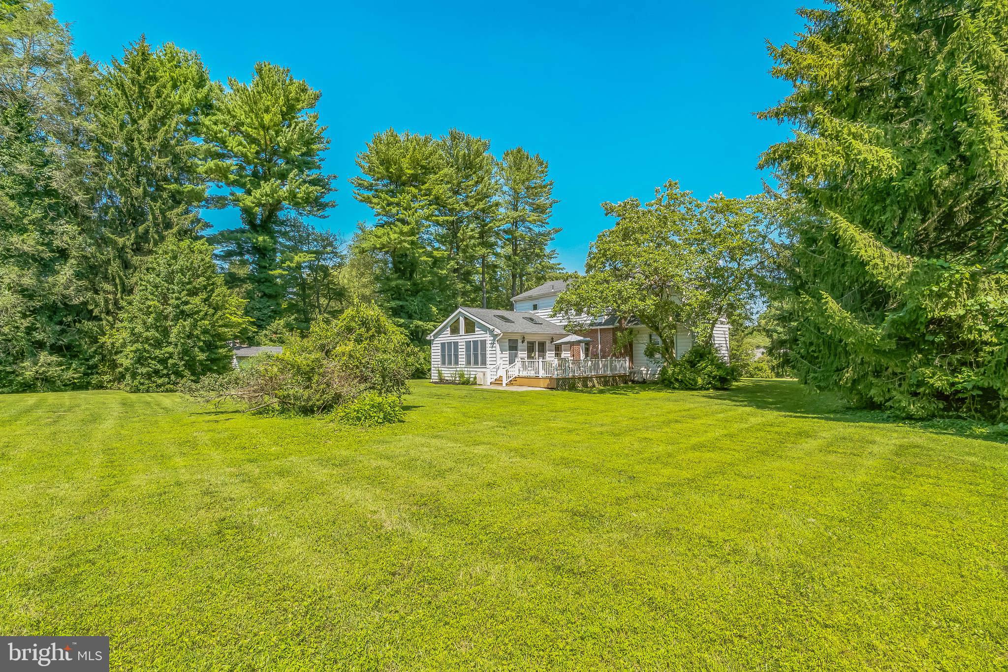 31 Rabbit Run Road Rose Valley, PA 19086 - Photo 20 of 35 a front view of a house with a garden