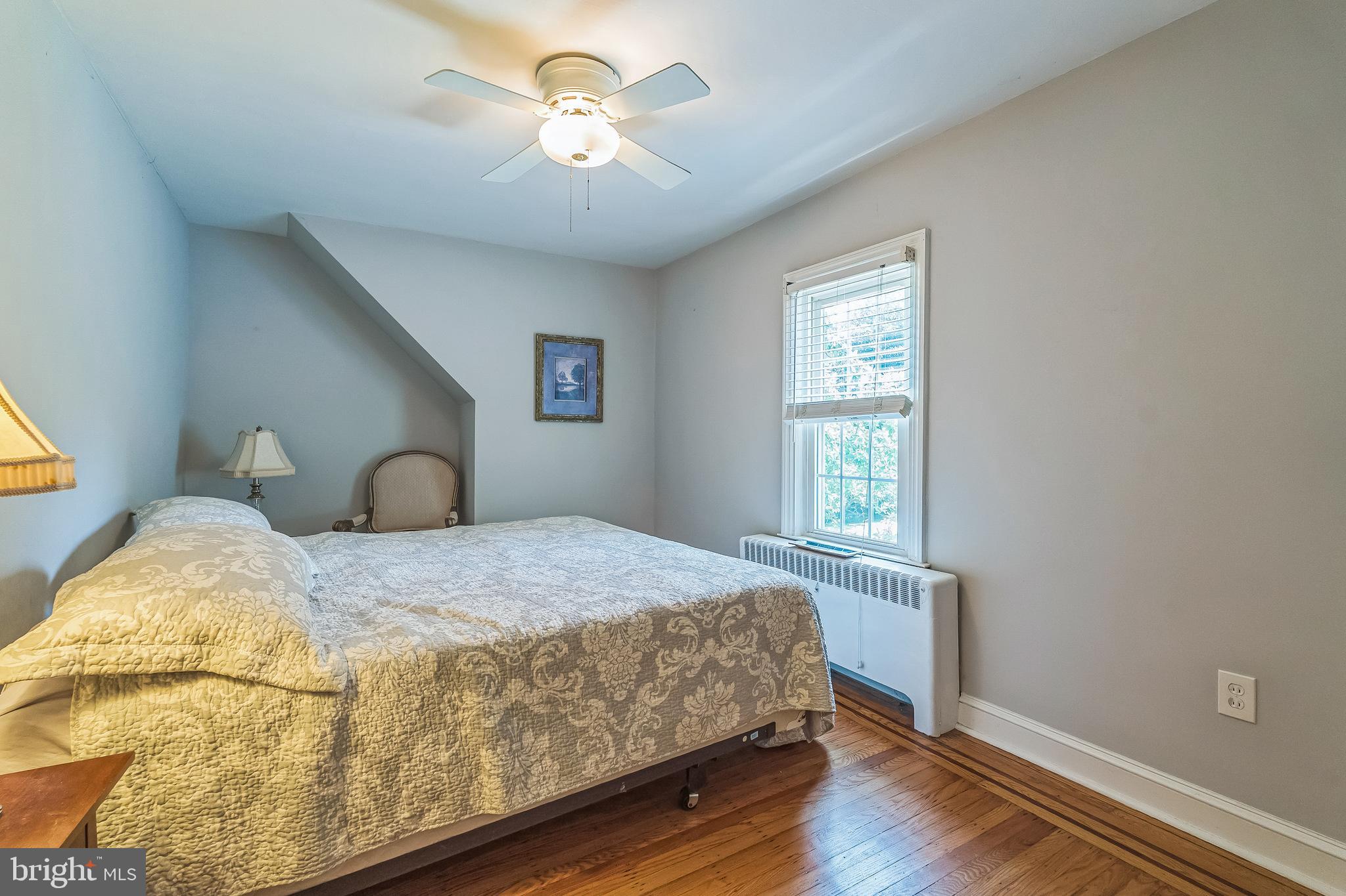 31 Rabbit Run Road Rose Valley, PA 19086 - Photo 26 of 35 a bedroom with a bed and wooden floor