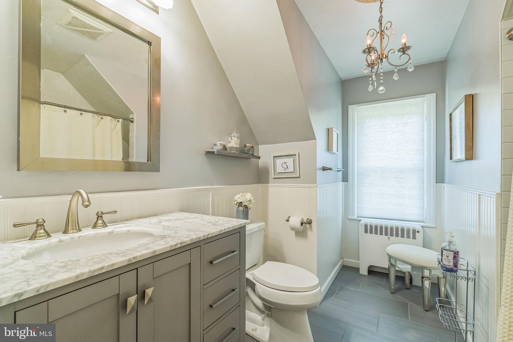 31 Rabbit Run Road Rose Valley, PA 19086 - Photo 28 of 35 a bathroom with a granite countertop sink a toilet and a mirror