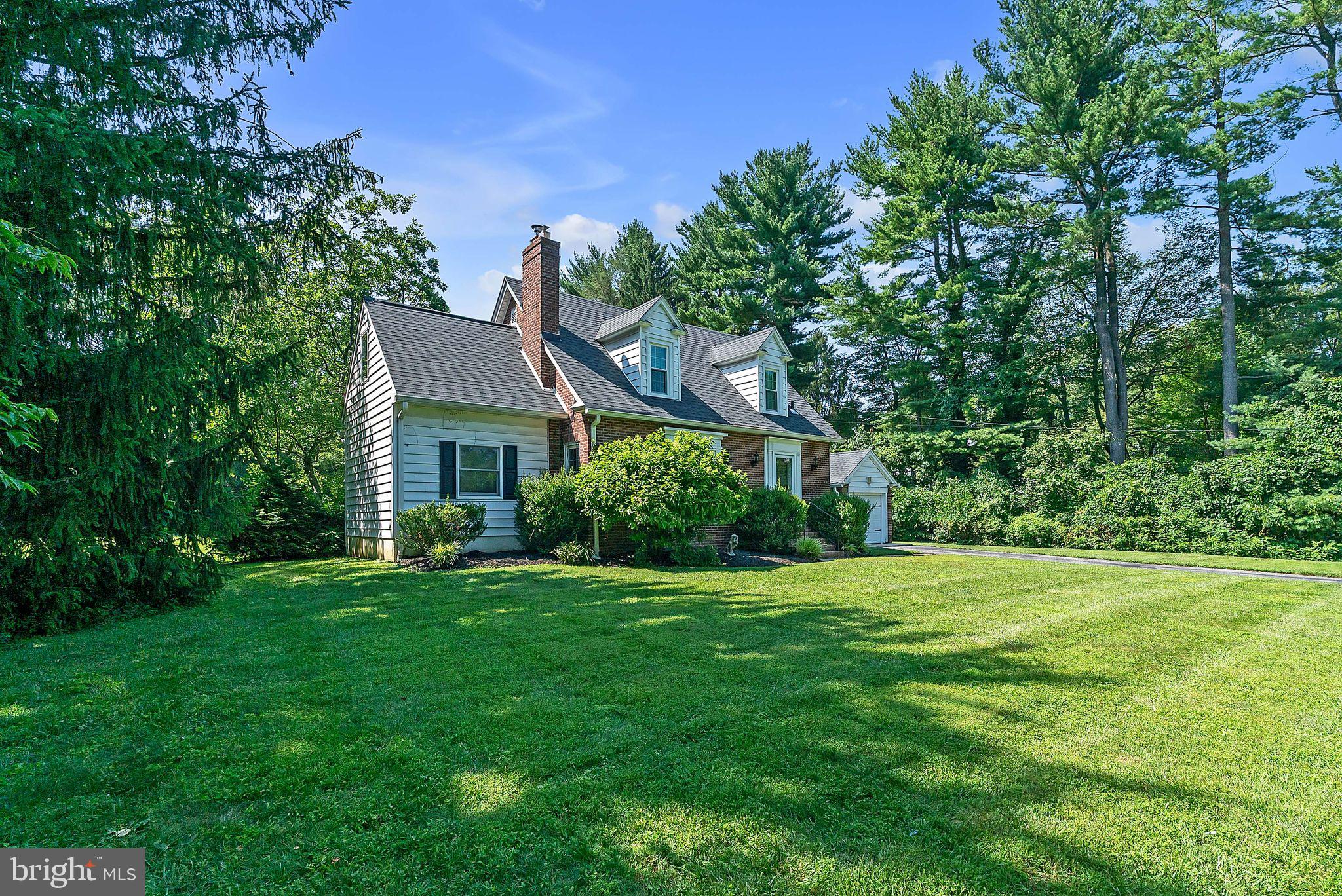 31 Rabbit Run Road Rose Valley, PA 19086 - Photo 3 of 35 a front view of a house with a yard