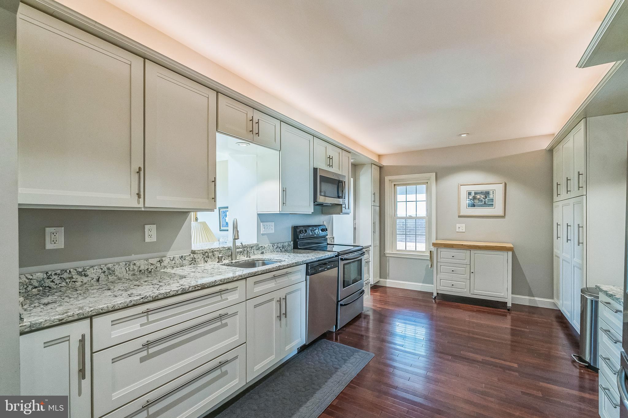31 Rabbit Run Road Rose Valley, PA 19086 - Photo 7 of 35 a kitchen with a sink stove top oven and cabinets