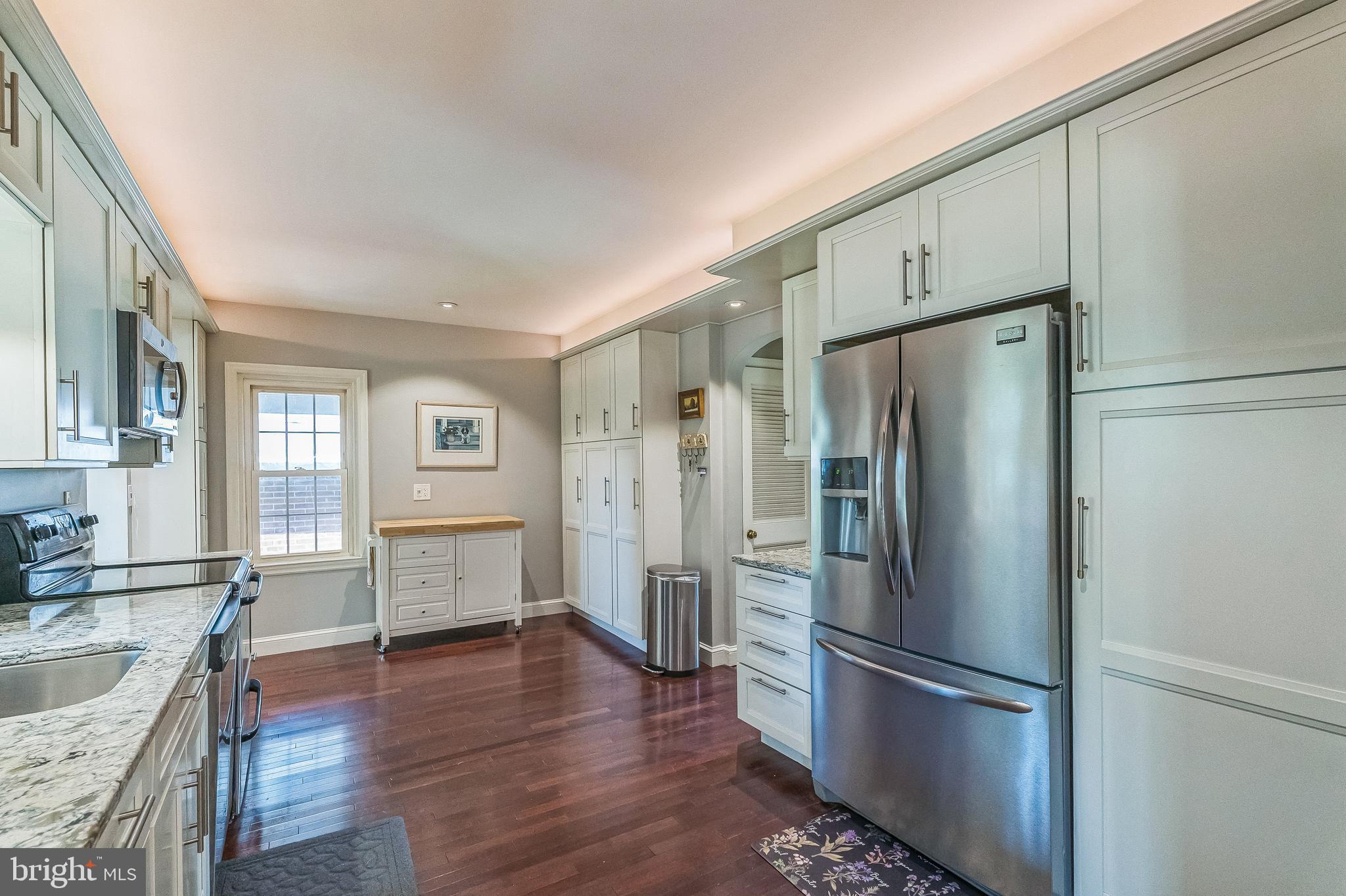 31 Rabbit Run Road Rose Valley, PA 19086 - Photo 8 of 35 a kitchen with stainless steel appliances granite countertop a refrigerator and a sink