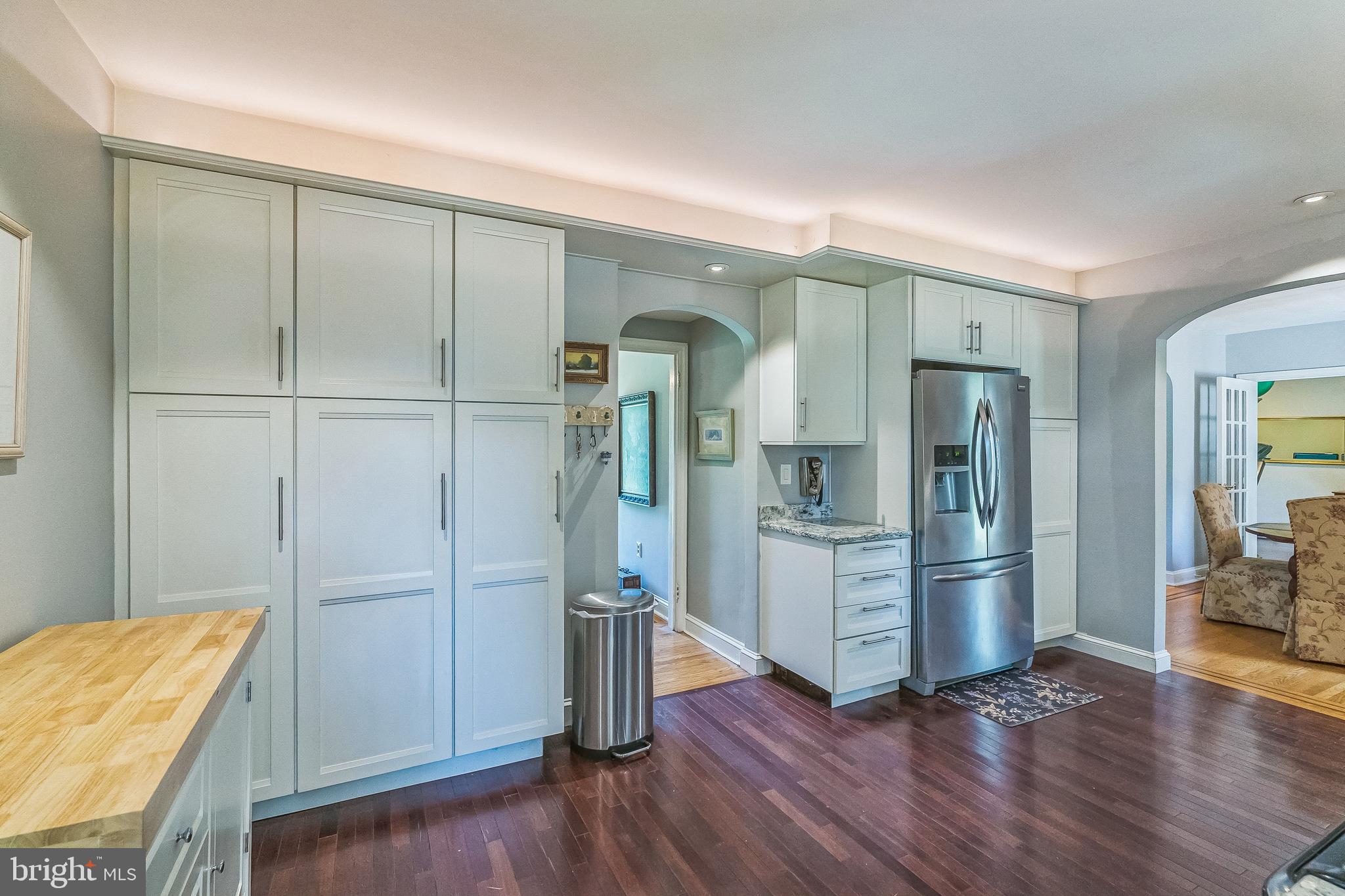 31 Rabbit Run Road Rose Valley, PA 19086 - Photo 10 of 35 a kitchen with stainless steel appliances wooden floor and chair
