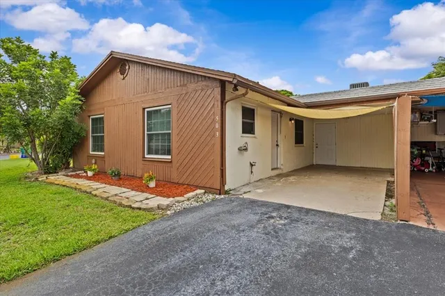 a backyard of a house with yard and garage