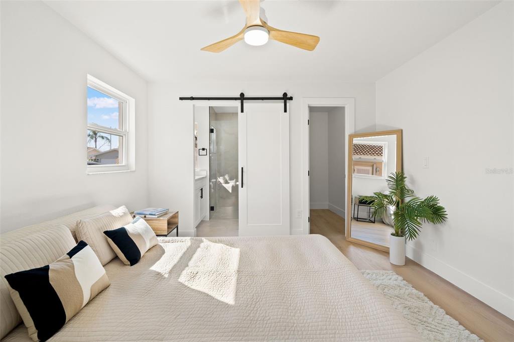 12671 115th Street Largo, FL 33778 - Photo 17 of 39 a bedroom with furniture and a potted plant