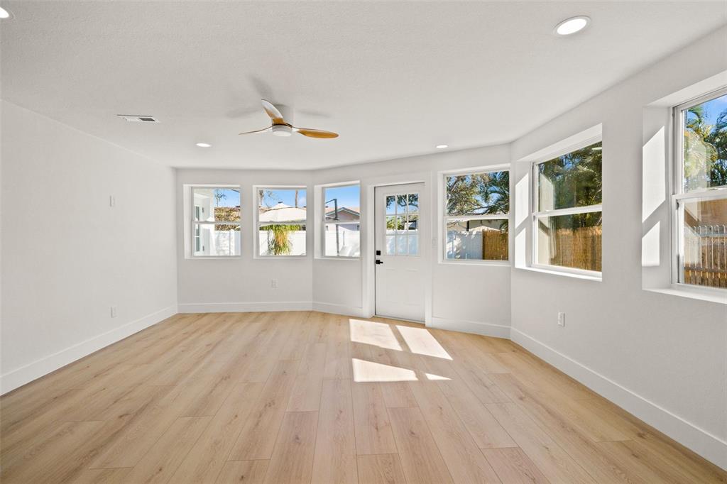12671 115th Street Largo, FL 33778 - Photo 22 of 39 wooden floor in an empty room with a window