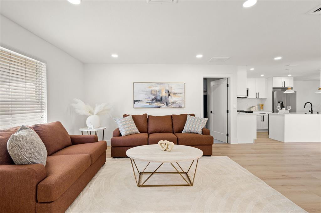 12671 115th Street Largo, FL 33778 - Photo 3 of 39 a living room with furniture and kitchen view