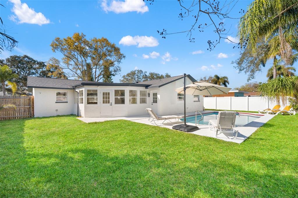 12671 115th Street Largo, FL 33778 - Photo 34 of 39 a view of a house with a yard and sitting area