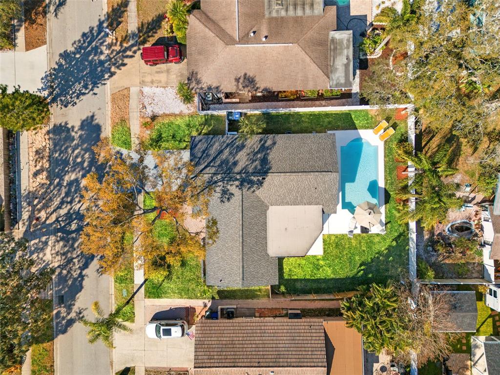 12671 115th Street Largo, FL 33778 - Photo 36 of 39 an aerial view of a house with a yard and garden