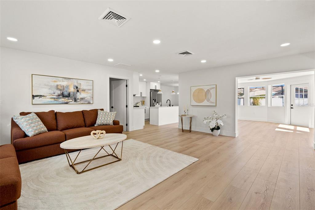12671 115th Street Largo, FL 33778 - Photo 4 of 39 a living room with furniture and wooden floor