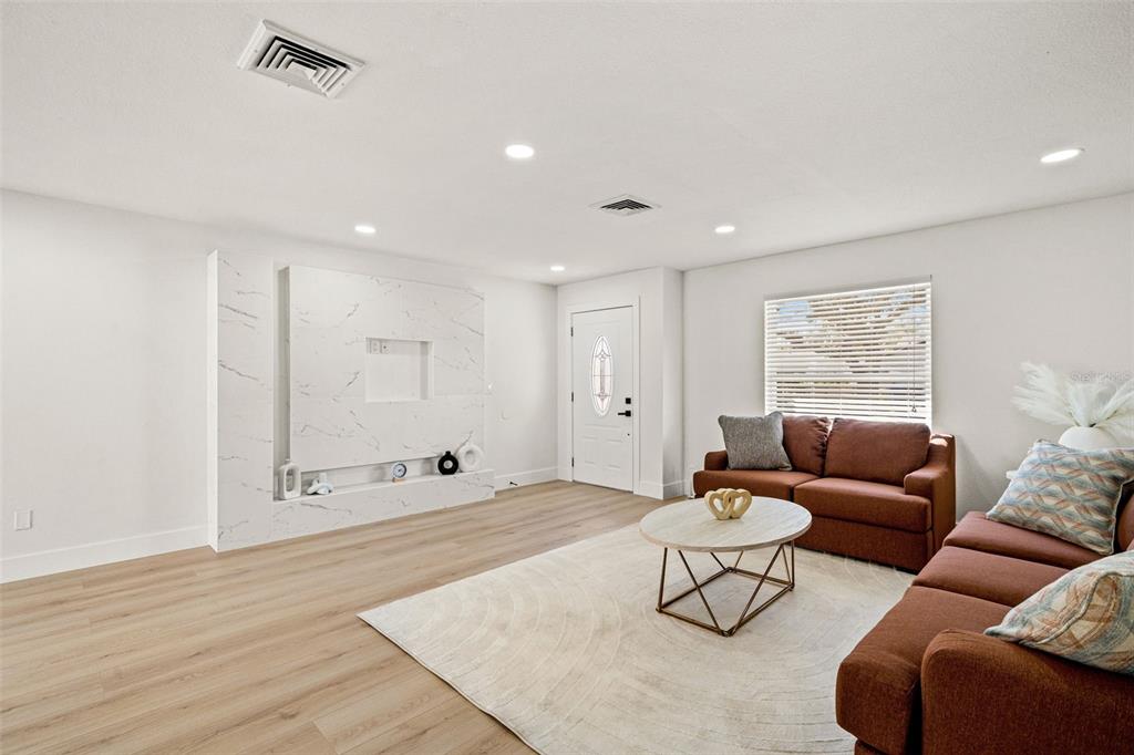 12671 115th Street Largo, FL 33778 - Photo 5 of 39 a living room with furniture and white walls