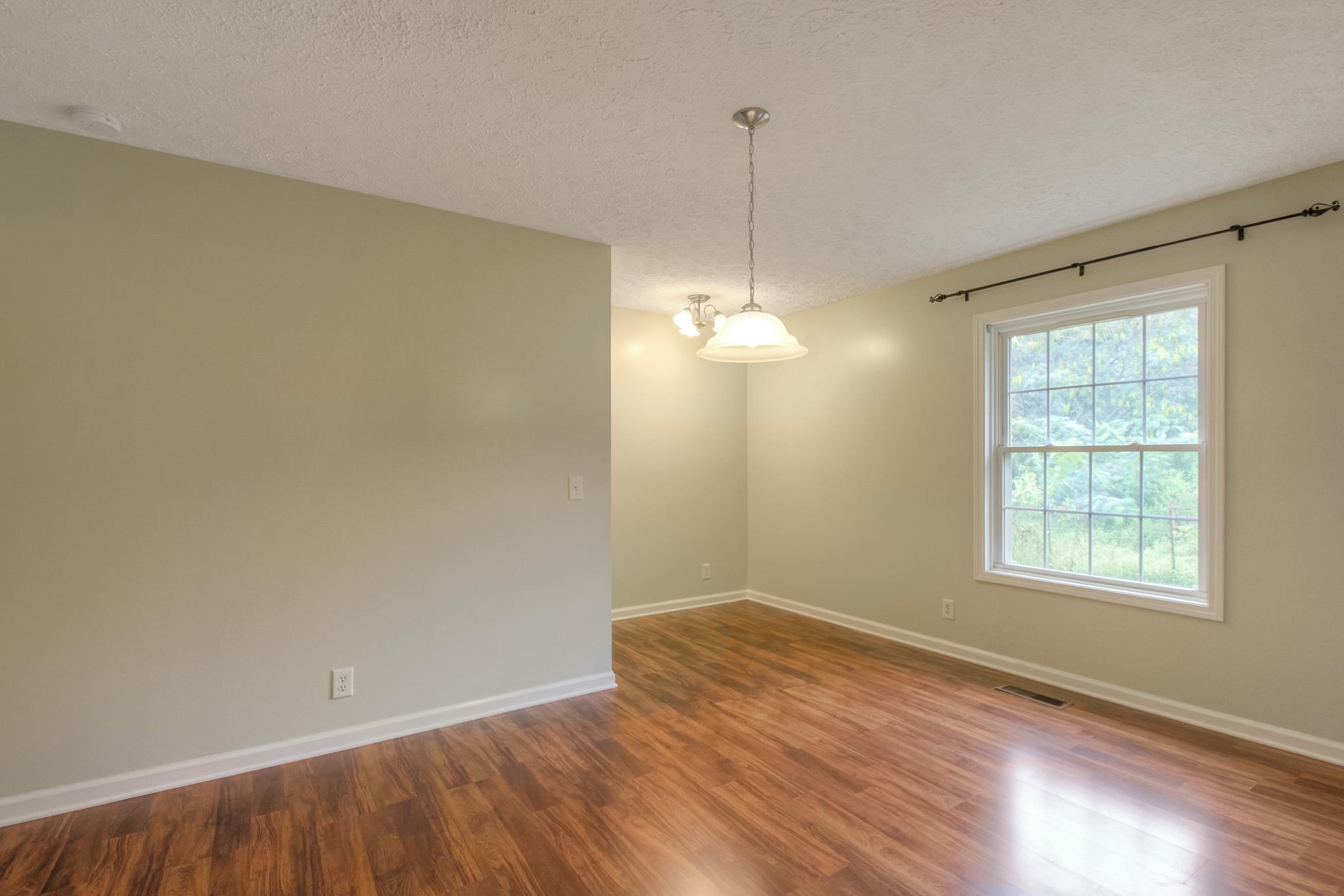 3352 Mahlon Moore Road Spring Hill, TN 37174 - Photo 14 of 30 wooden floor in an empty room with a window