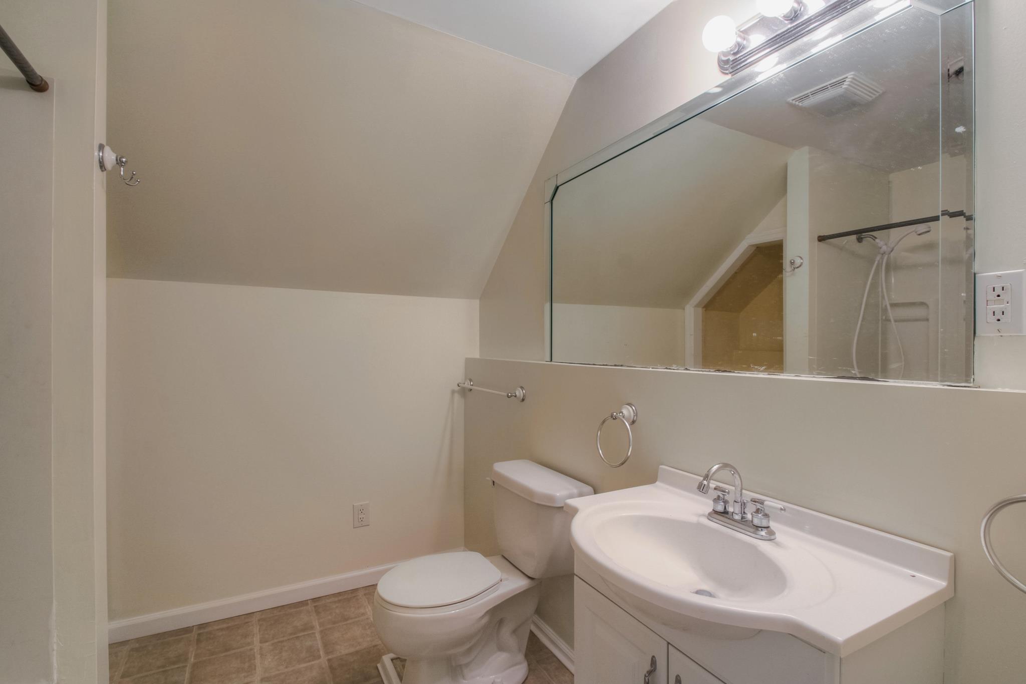 3352 Mahlon Moore Road Spring Hill, TN 37174 - Photo 22 of 30 a bathroom with a sink toilet and a mirror