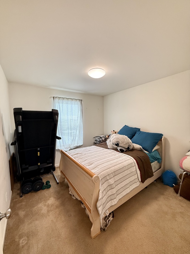 522 Windett Ridge Road Yorkville, IL 60560 - Photo 12 of 20 a bedroom with a bed and a television