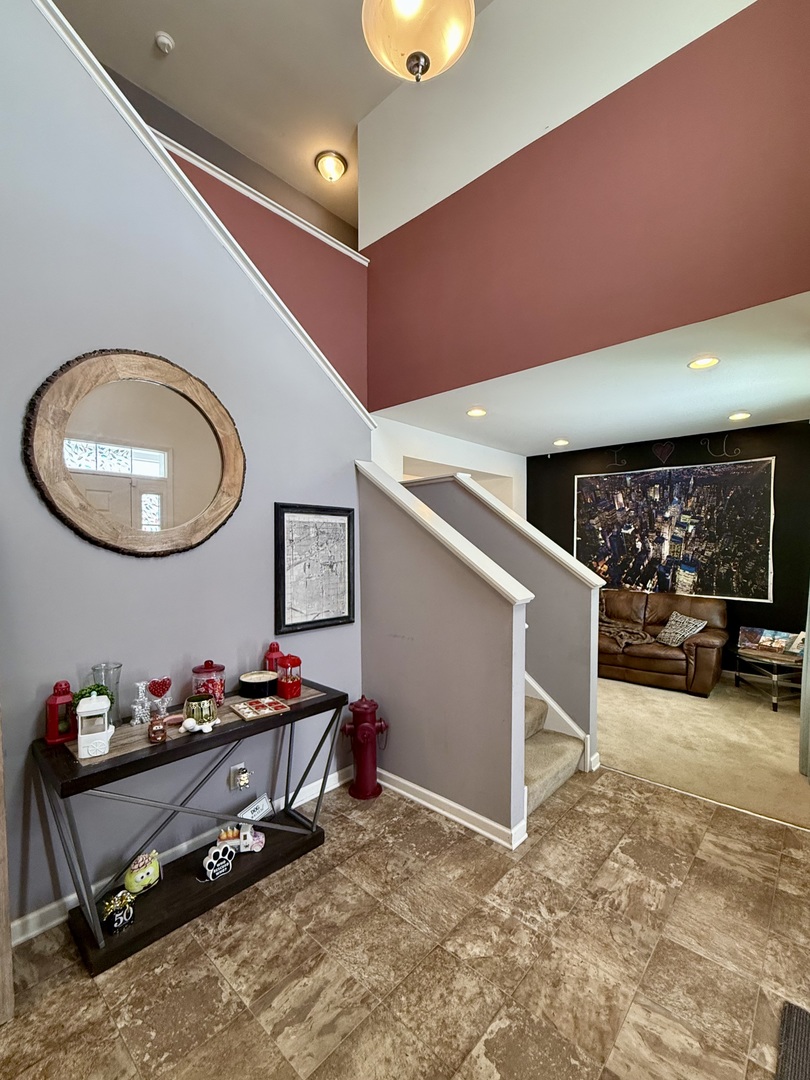 522 Windett Ridge Road Yorkville, IL 60560 - Photo 2 of 20 a gym room with furniture and a ceiling fan