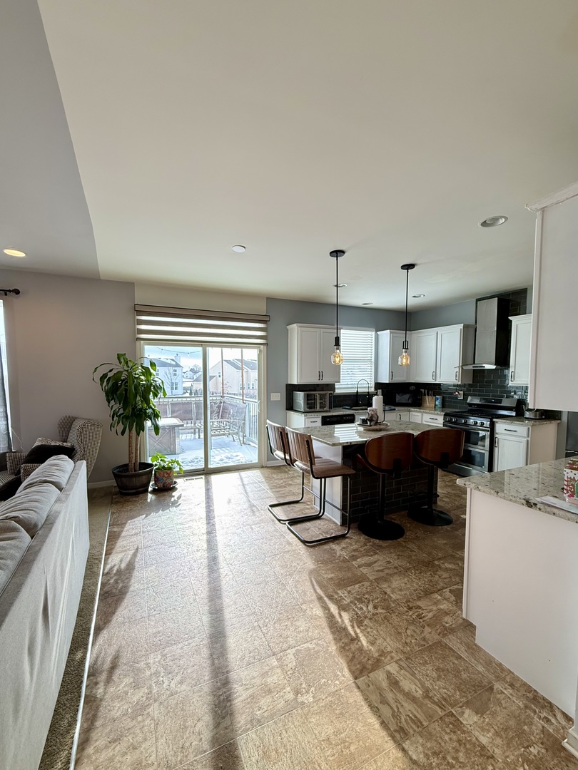 522 Windett Ridge Road Yorkville, IL 60560 - Photo 5 of 20 a living room with furniture and a large window