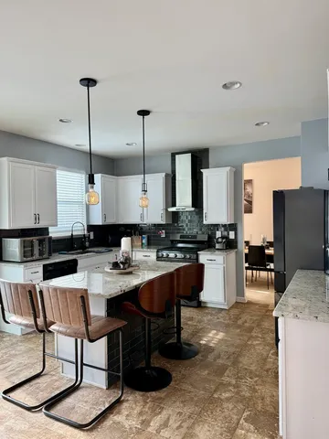 a kitchen with counter space cabinets and appliances