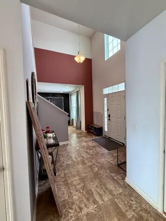 a view of a livingroom with furniture and staircase