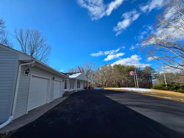 a kitchen with kitchen island a sink stainless steel appliances and cabinets