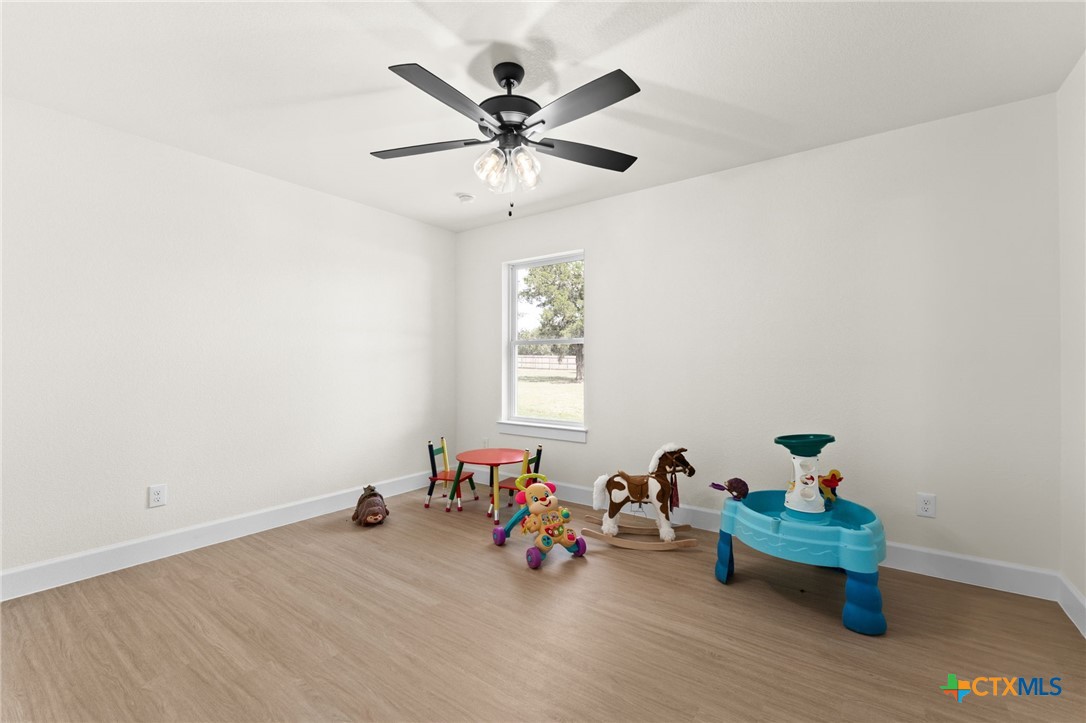 3025 Millhouse Road Copperas Cove, TX 76522 - Photo 25 of 38 a view of a workspace with furniture chandelier fan and a window