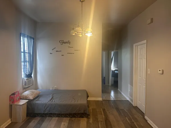 a bed room with a bed and a window