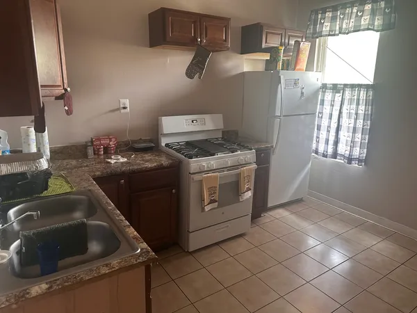 a kitchen that has a sink and a stove