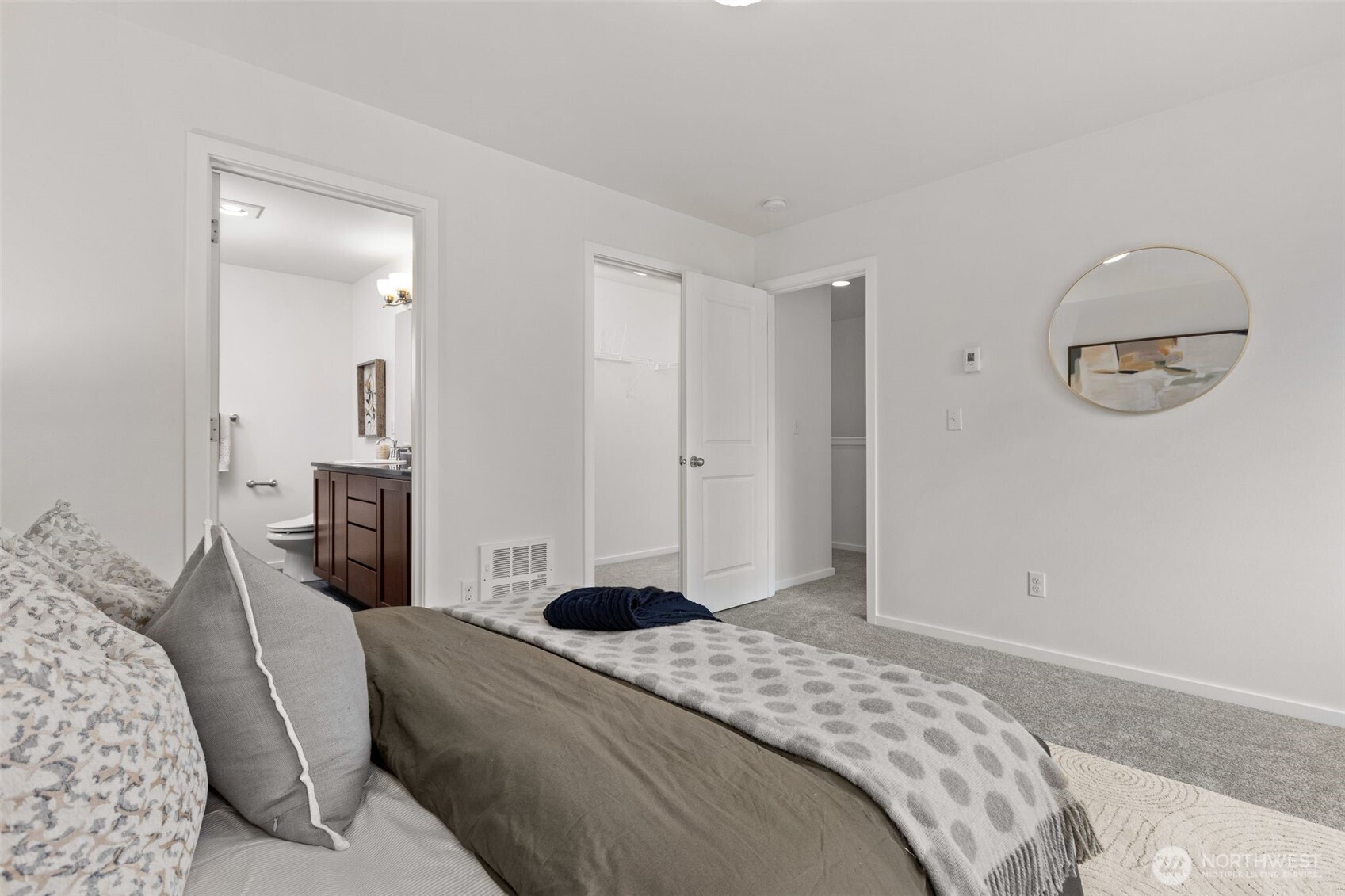 16516 2nd Park Southeast Bothell, WA 98012 - Photo 21 of 39 a bedroom with a bed and a mirror