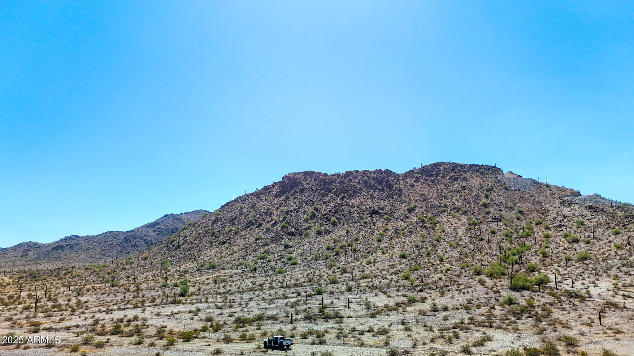 0 West Hilldale Road Maricopa, AZ 85139 - Photo 11 of 15 a view of a large mountain range with trees in the background