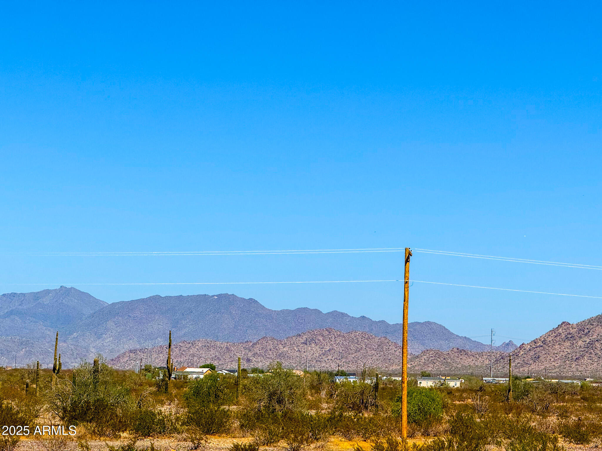 0 West Hilldale Road Maricopa, AZ 85139 - Photo 8 of 15 a view of a lake with a mountain in the background