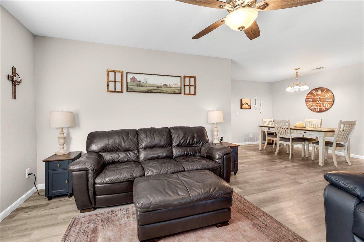 2110 Gentry Way Red Bluff, CA 96080 - Photo 9 of 47 a living room with furniture and wooden floor