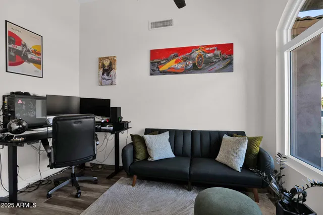 a living room with furniture workspace and a window