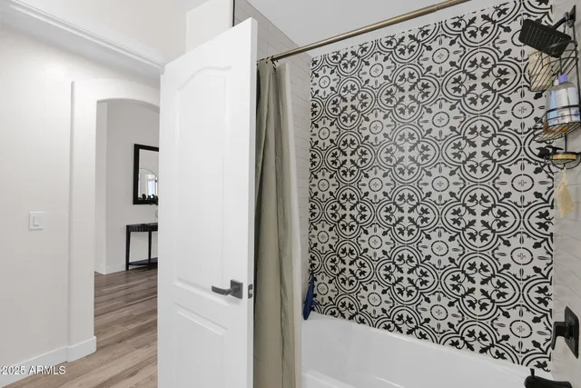 a bathroom with a bathtub and shower