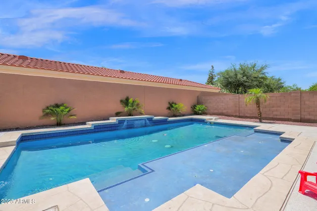 a backyard with potted plants