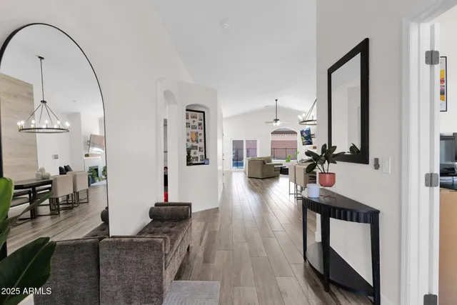 a view of living room filled with furniture and wooden floor