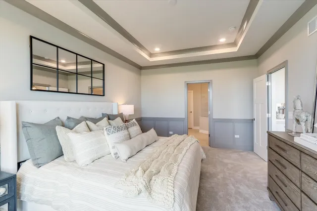 a bedroom with a bed and a couch