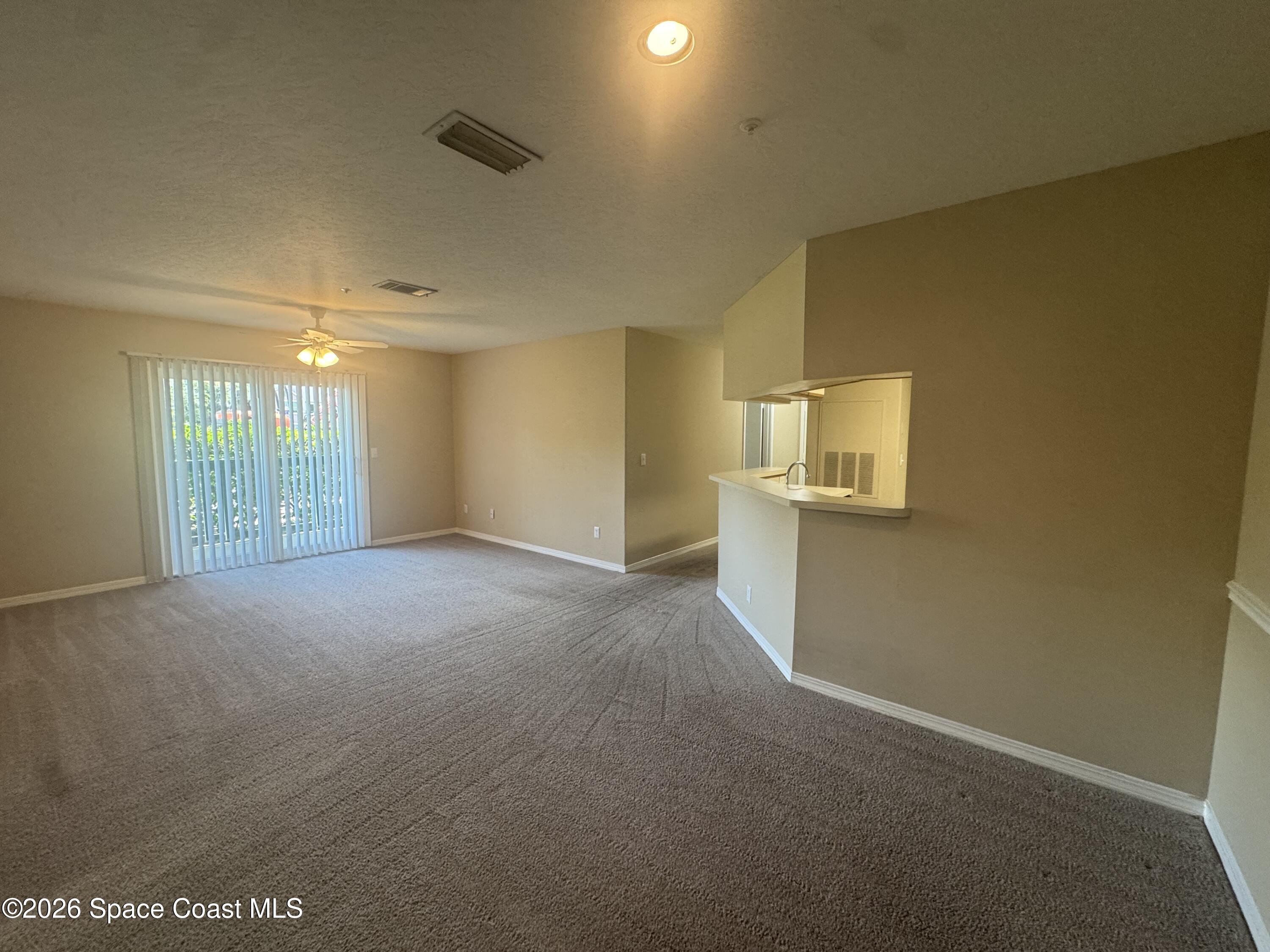 7667 North Wickham Road, Unit 1107 Melbourne, FL 32940 - Photo 3 of 19 a view of an empty room with a window