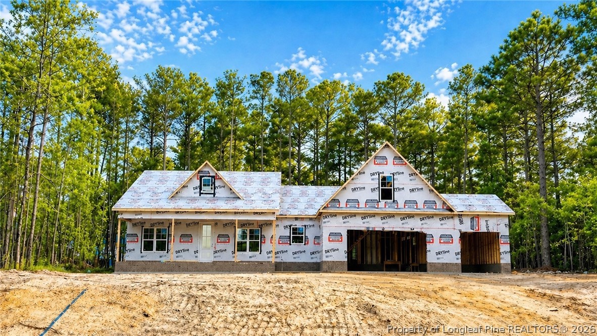 26640 Peach Orchard Road Wagram, NC 28396 - Photo 3 of 3 a front view of a house with a garden