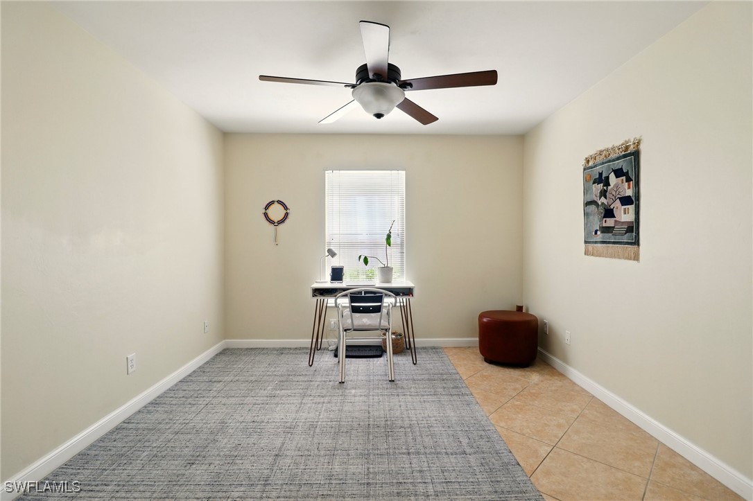 6283 Shadowood Circle Naples, FL 34112 - Photo 16 of 31 a living room with furniture and a window