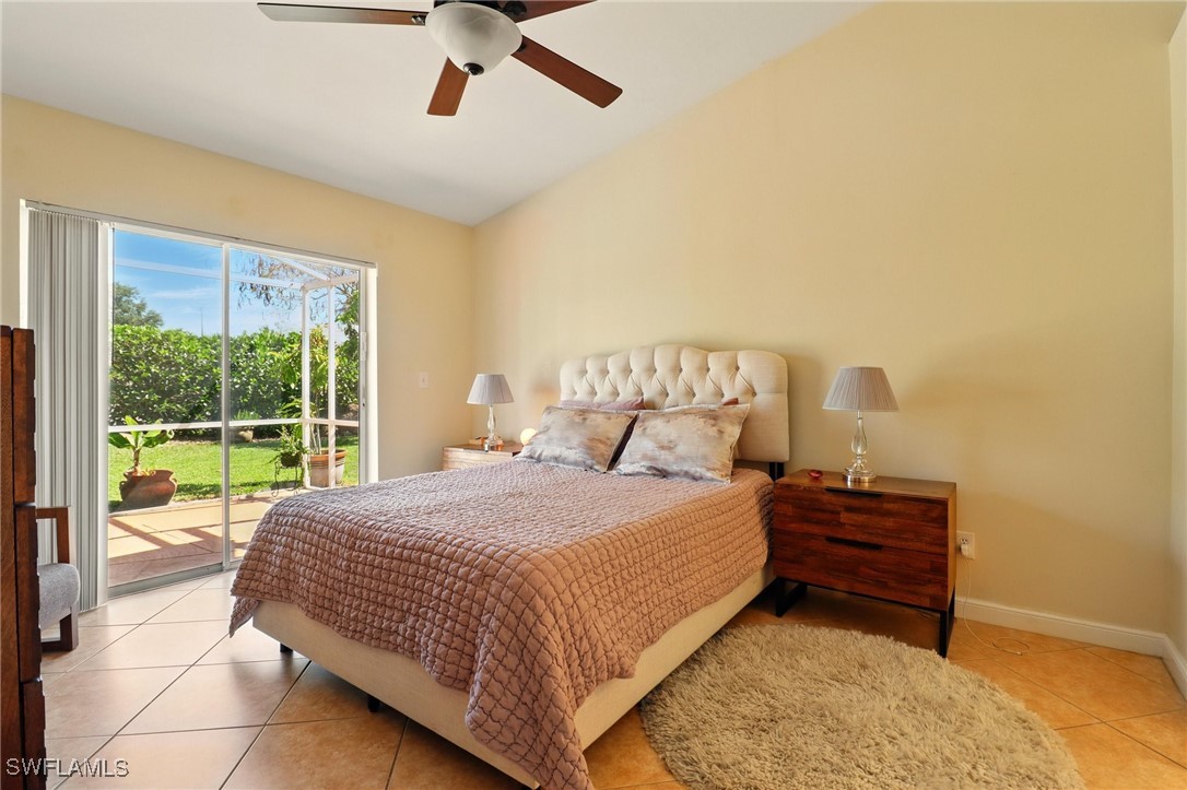 6283 Shadowood Circle Naples, FL 34112 - Photo 18 of 31 a bedroom with a bed and window