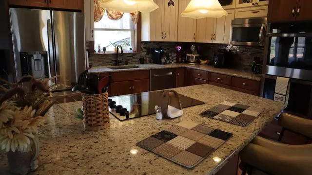 a kitchen with a sink and a stove top oven