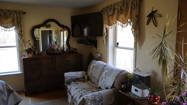 a living room with furniture and a window