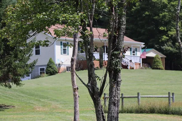 a view of swimming pool from a backyard
