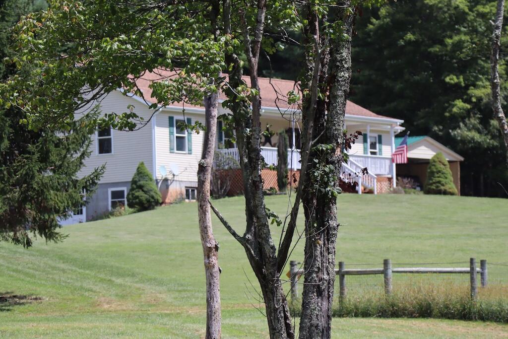1247 Cannady School Road Southeast Floyd, VA 24091 - Photo 30 of 54 a front view of a house with garden