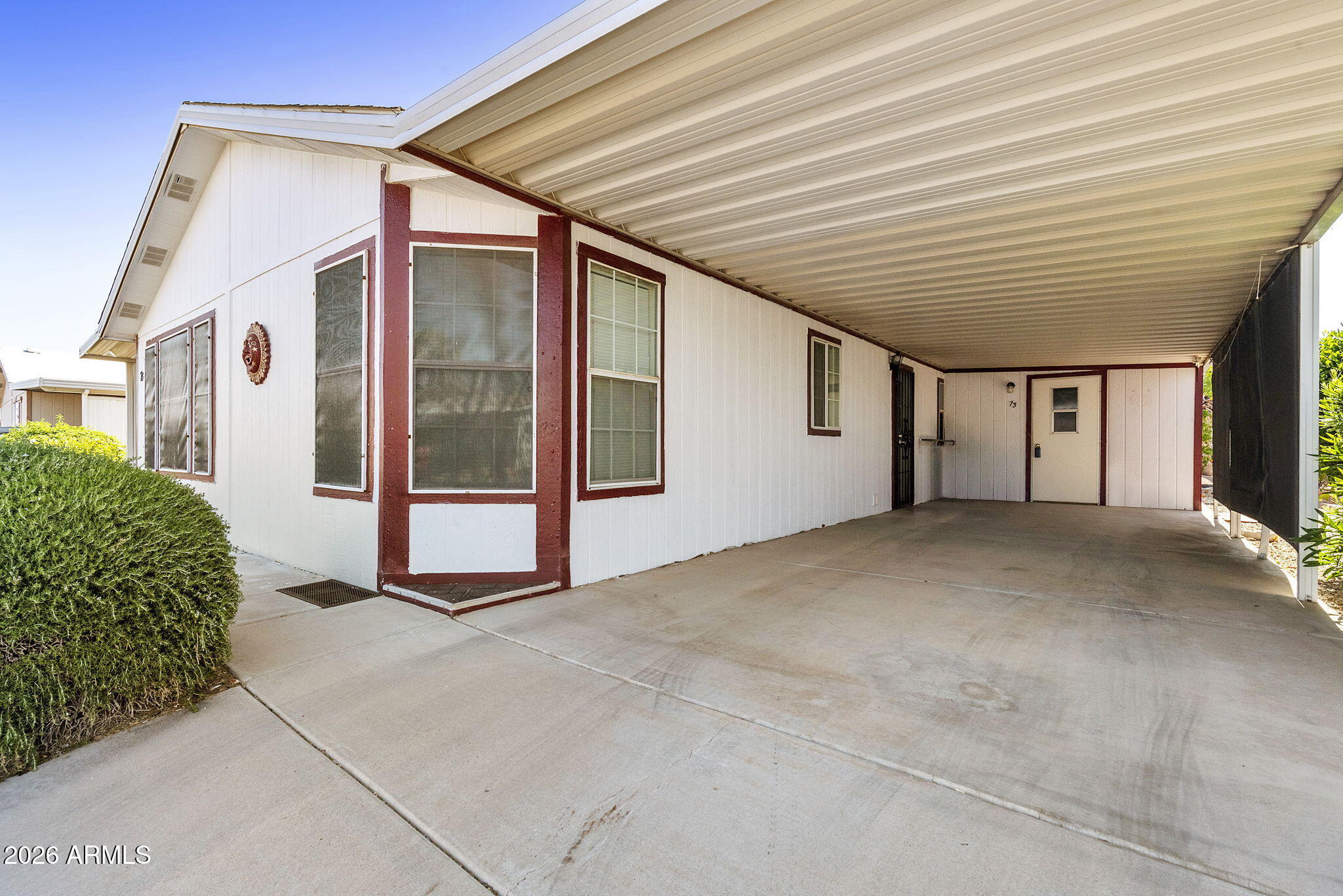 3700 South Tomahawk Road, Unit 73 Apache Junction, AZ 85119 - Photo 3 of 49 a view of an empty room with a balcony