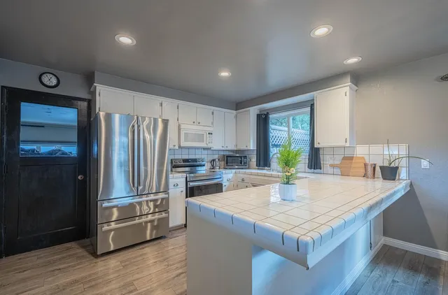 a kitchen with a sink and cabinets