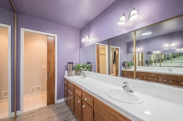 a view of room with window and wooden floor