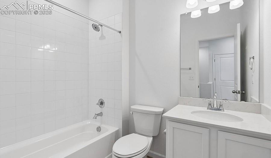 2485 Serviceberry Grove Colorado Springs, CO 80915 - Photo 12 of 22 a bathroom with a sink a toilet and shower