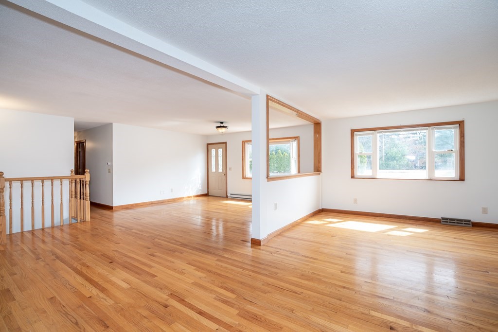 127 Upper Hampden Road Monson, MA 01057 - Photo 19 of 42 a view of an empty room with wooden floor and a window