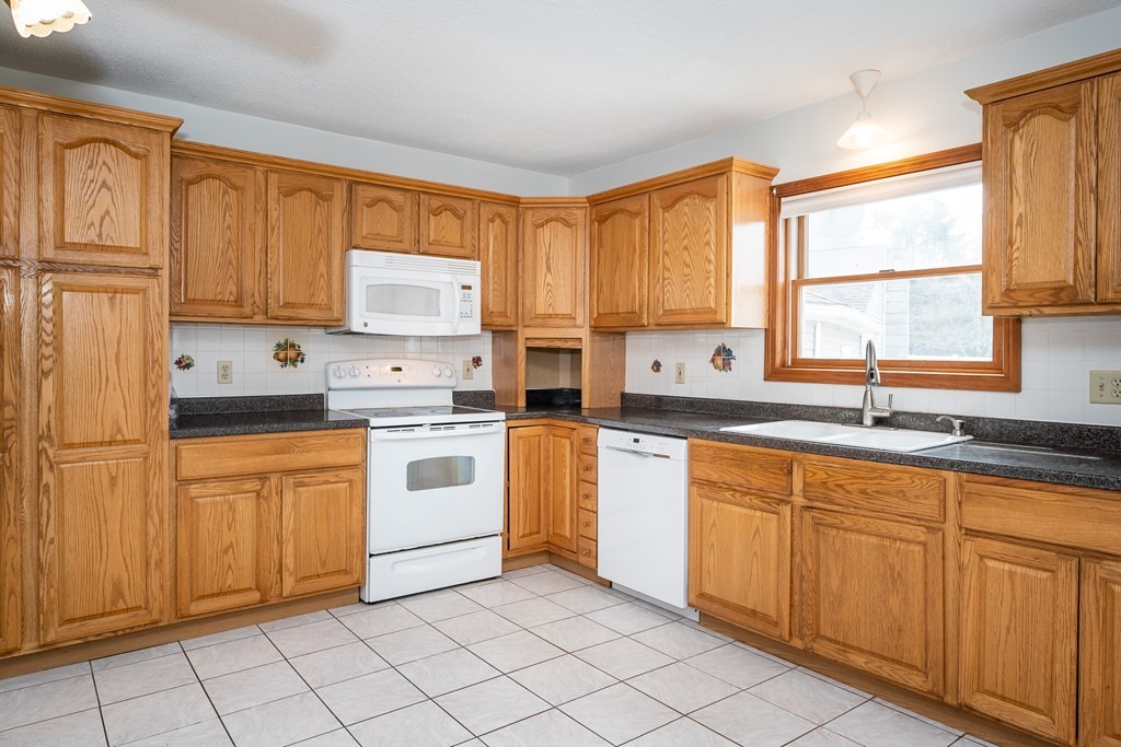 127 Upper Hampden Road Monson, MA 01057 - Photo 25 of 42 a kitchen with stainless steel appliances granite countertop a sink and cabinets
